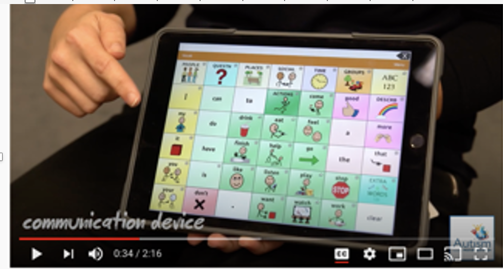 screenshot of video player with colorful grid of images, text and unseen person holding the item and pointing to the screen