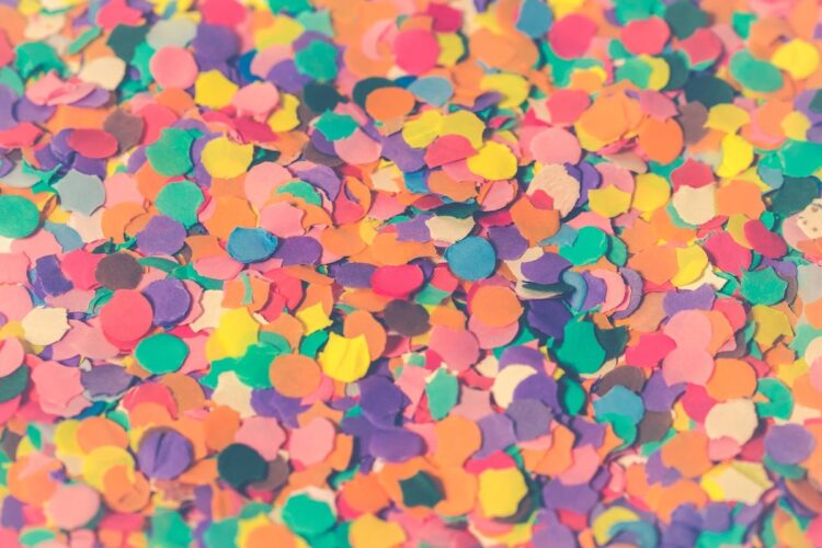 pastel confetti scattered across a desk