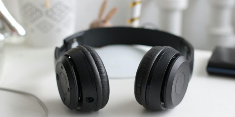 Black headphones on a white desk