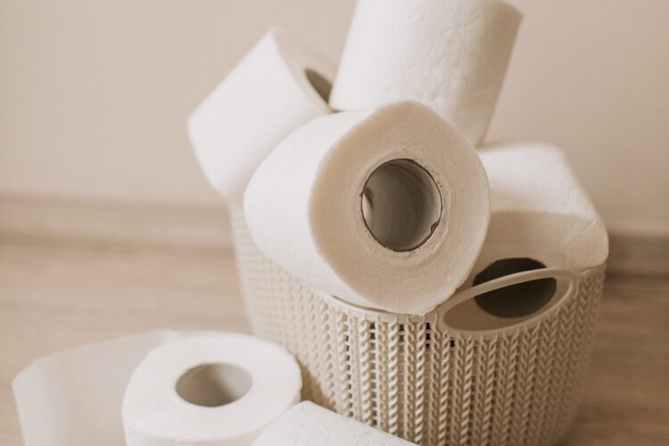 A pile of toilet rolls in a basket