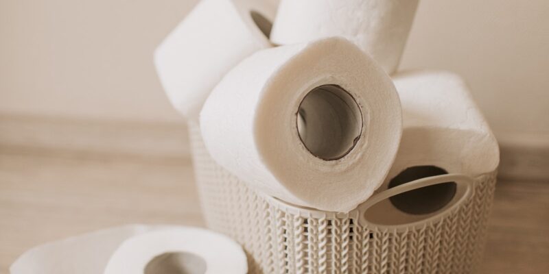 A pile of toilet rolls in a basket