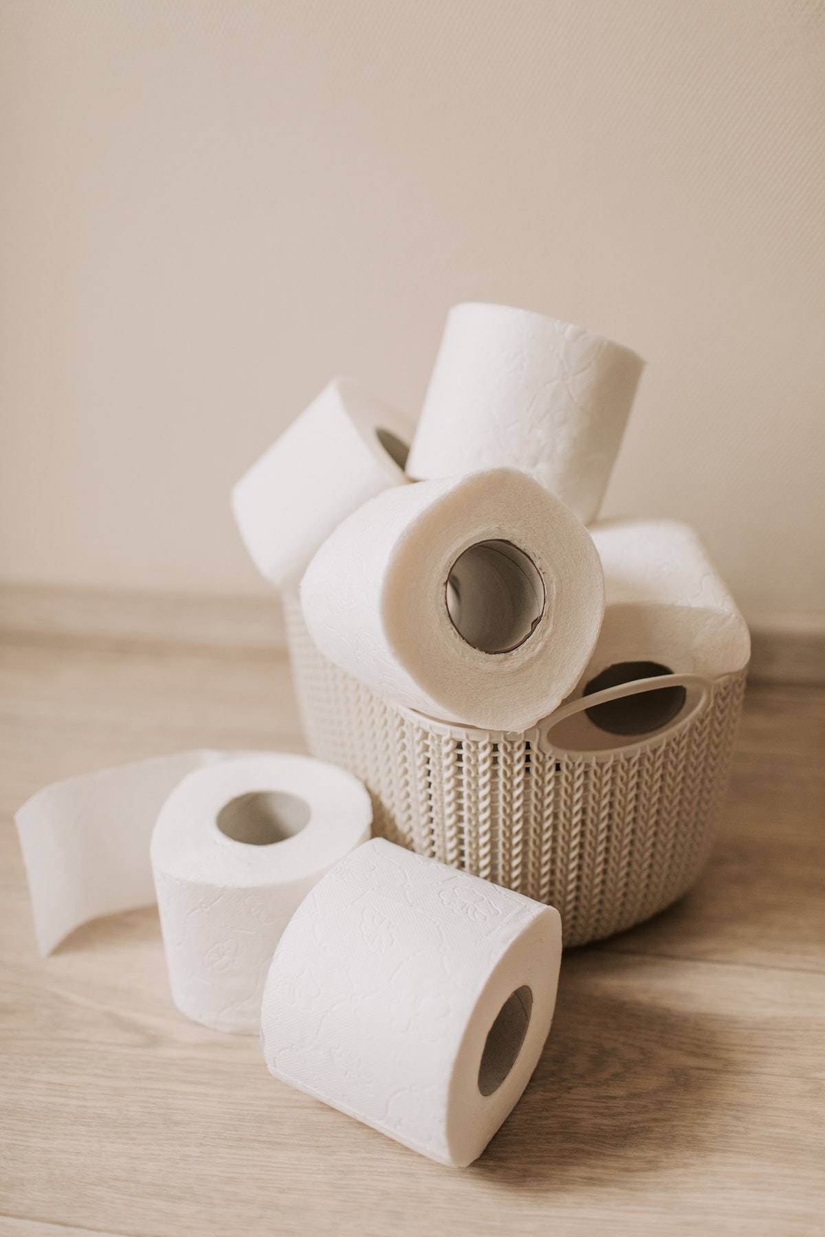 A pile of toilet rolls in a basket