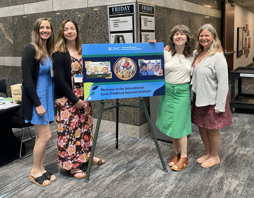 Four pale-skinned women pose for a photo at the Early Childhood conference