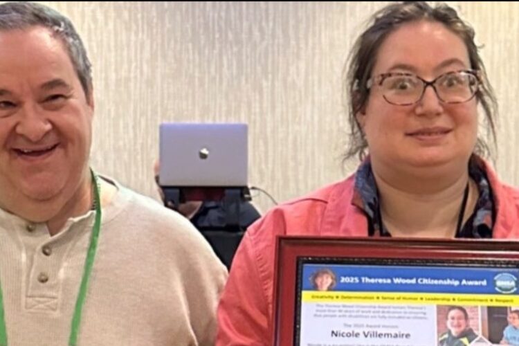 Nicole poses with David Frye after being presented with the self-advocate award